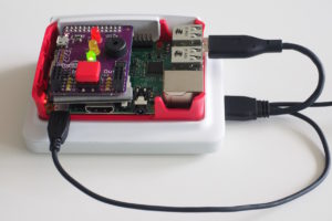 Abbildung 1: Die RasPi-Erweiterung Pibrella bietet schaltbare LEDs und einen Taster für Eingaben.